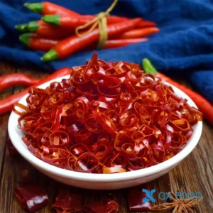 Dried chili rings CR-C16 -- thin paper-thin dried red chili rings in white ceramic sample dish